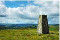 Trig point and view to the Brecon Beacons