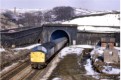 40-hauled passenger leaves the tunnel at Diggle