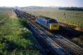 Class 40 hauls a southbound empty car-carrier, Lucker, 10 July 1978