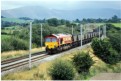 66 044 heads a southbound coal train near Docker Hall