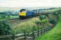 Cl 47 heads westbound oil tanks, Greenfield