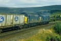 A pair of 37s on Ford containers, eastbound at Greenfield