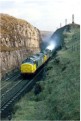 37 677 leads a stone train towards Dove Holes tunnel