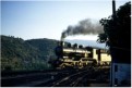 An inside cylindered 4-6-0 leaves Regua with an evening train