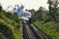 7029 "Clun Castle" steams out of the sun near Preston Boats